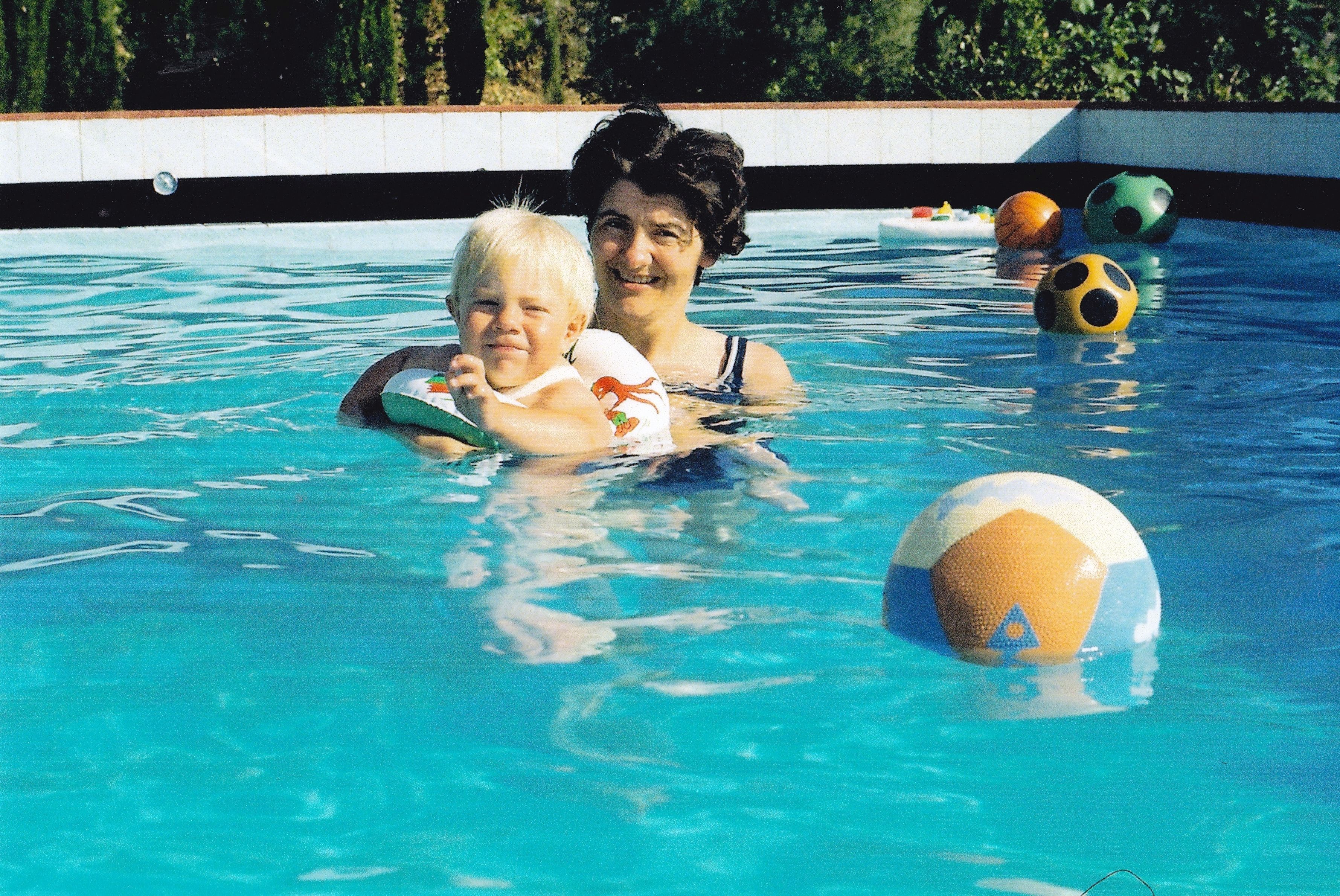 Mum and little me in the swimming pool, with bright colours